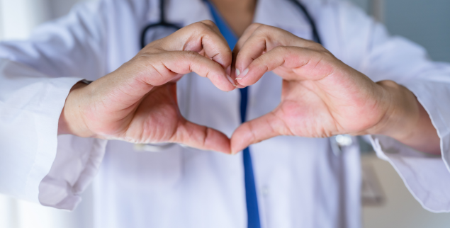 Doctor making heart sign