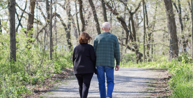 Couple walking on a nice day to improve health